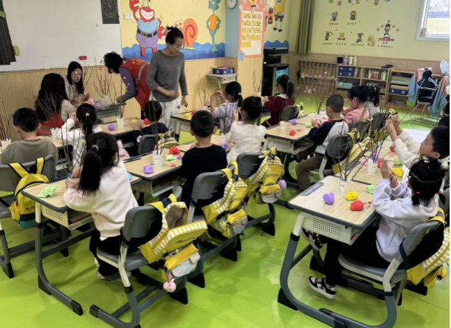 太原万柏林区神堂沟街道义井西社区：植绿润童心  巧手扮春光